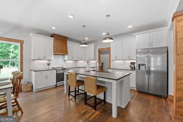 kitchen featuring appliances with stainless steel finishes, white cabinetry, and sink