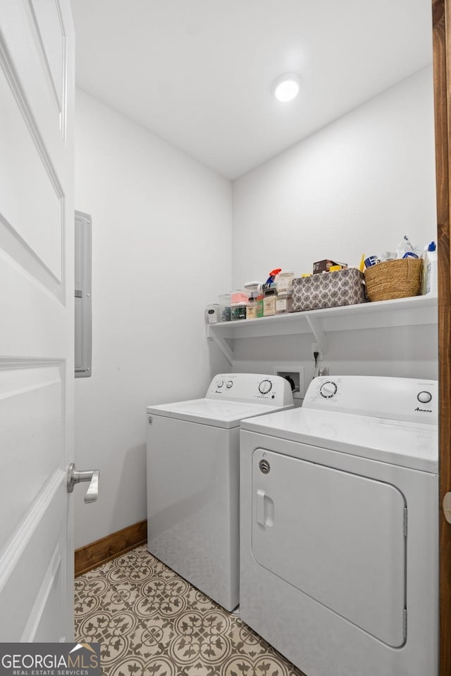 clothes washing area featuring separate washer and dryer and light tile patterned floors