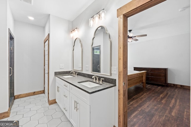 bathroom with tile patterned floors, ceiling fan, and vanity