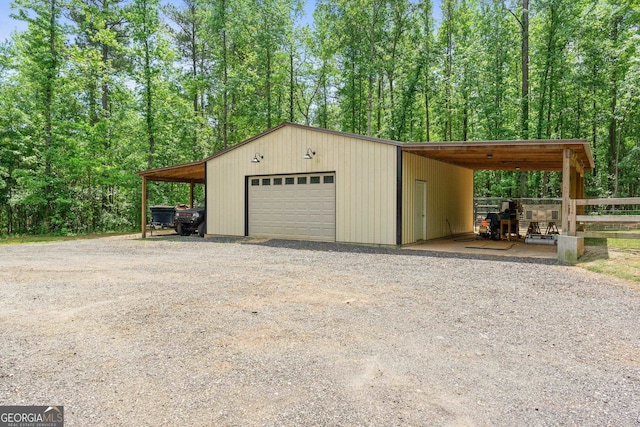 garage featuring a carport