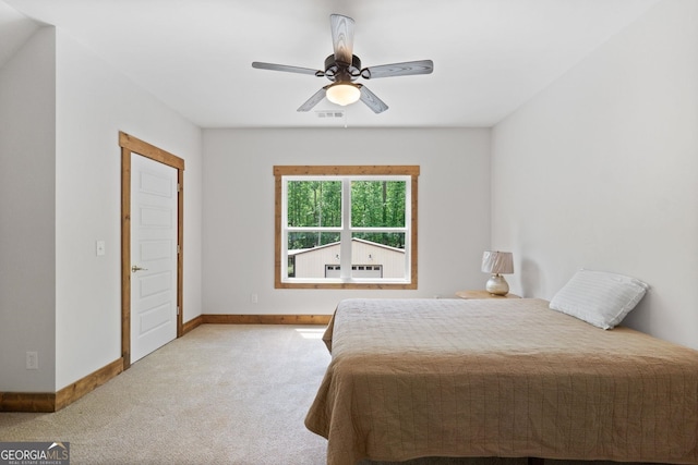 bedroom featuring light carpet and ceiling fan