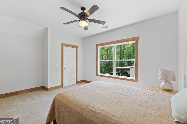 bedroom featuring ceiling fan and light carpet