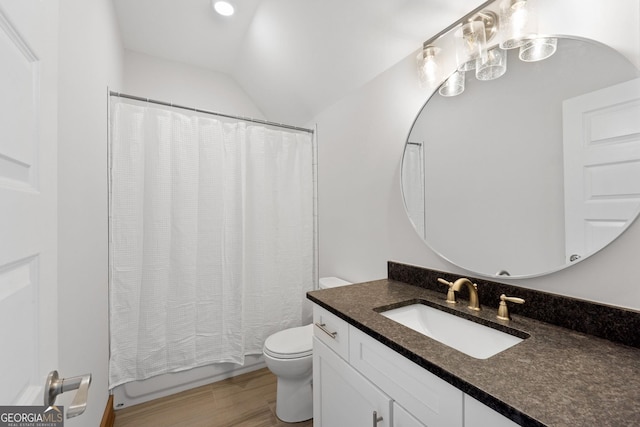 full bathroom featuring shower / bath combination with curtain, vanity, vaulted ceiling, wood-type flooring, and toilet