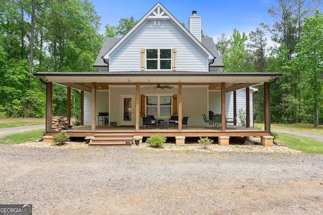 farmhouse inspired home featuring a porch and ceiling fan