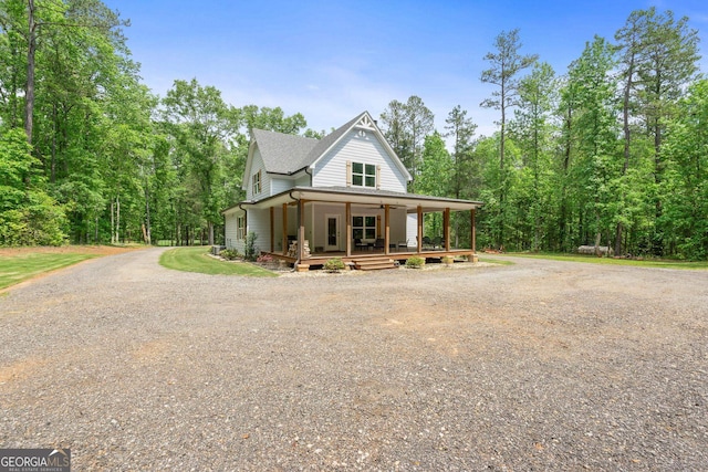 farmhouse featuring covered porch