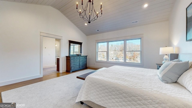 bedroom featuring a chandelier, light hardwood / wood-style floors, vaulted ceiling, and wooden ceiling