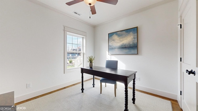 office space featuring ceiling fan, light hardwood / wood-style floors, and crown molding