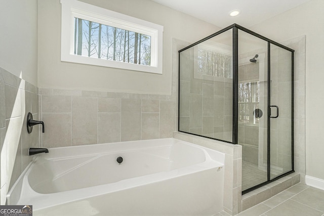 full bathroom featuring tile patterned flooring, a garden tub, a shower stall, and recessed lighting