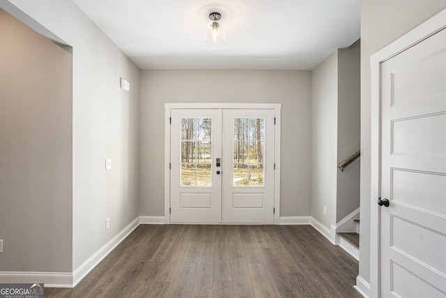 entryway featuring stairs, baseboards, dark wood-style flooring, and french doors