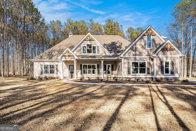 craftsman-style house with a front lawn