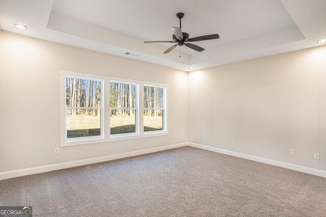 kitchen with a center island with sink, sink, vaulted ceiling, a fireplace, and decorative light fixtures