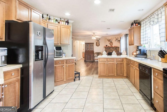 kitchen featuring kitchen peninsula, stainless steel refrigerator with ice dispenser, ceiling fan, sink, and black dishwasher