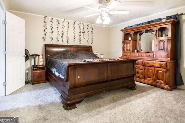 bedroom featuring ceiling fan and light carpet