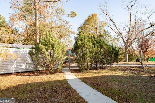 view of home's community with a lawn