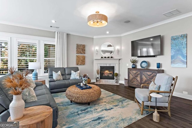 living room with dark wood-type flooring and ornamental molding