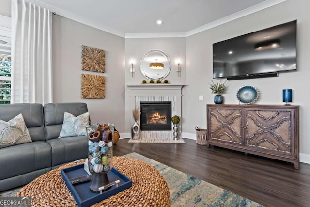 living room with hardwood / wood-style flooring and ornamental molding