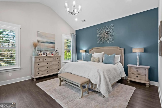 bedroom with a chandelier, dark hardwood / wood-style flooring, and vaulted ceiling