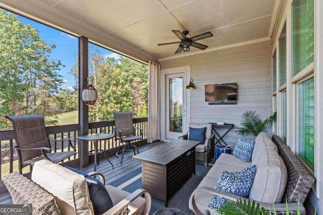 sunroom / solarium with ceiling fan