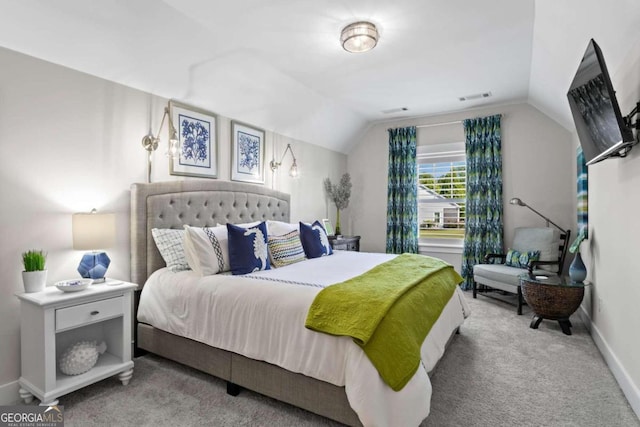 bedroom featuring carpet floors and vaulted ceiling