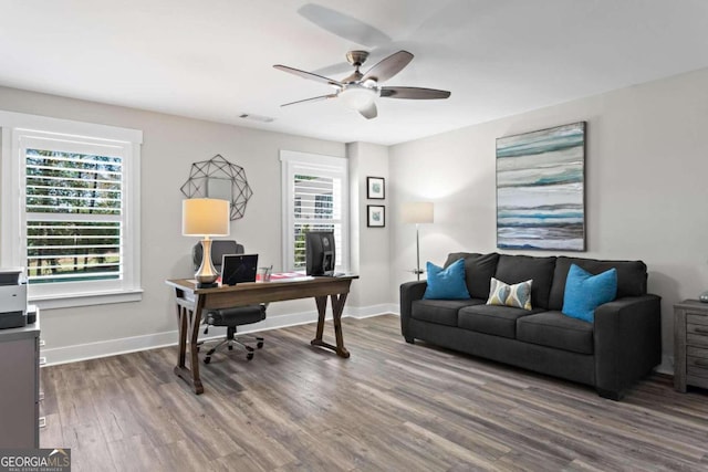 home office featuring hardwood / wood-style flooring and ceiling fan