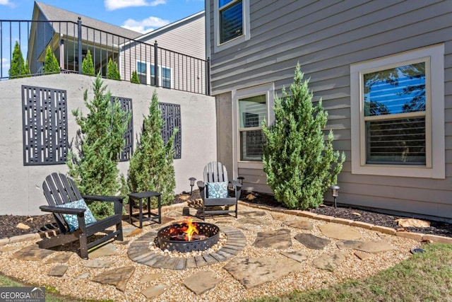 view of patio / terrace with a fire pit