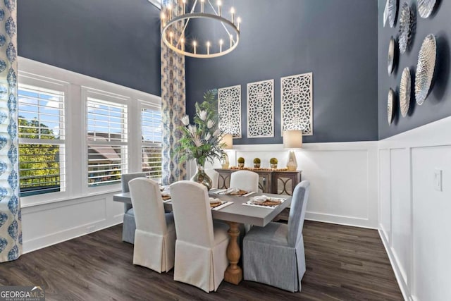 dining area with a chandelier, dark hardwood / wood-style floors, and a wealth of natural light