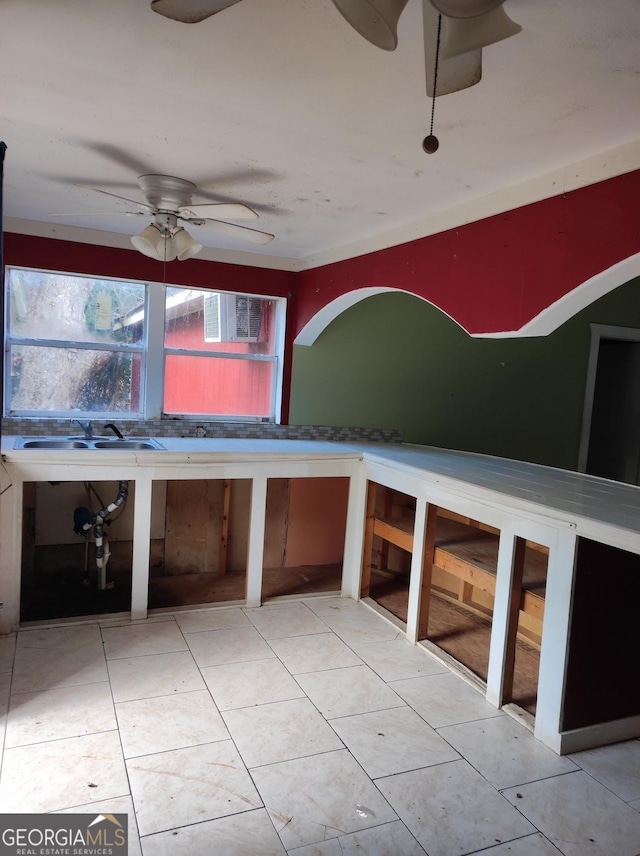 kitchen with ceiling fan and sink