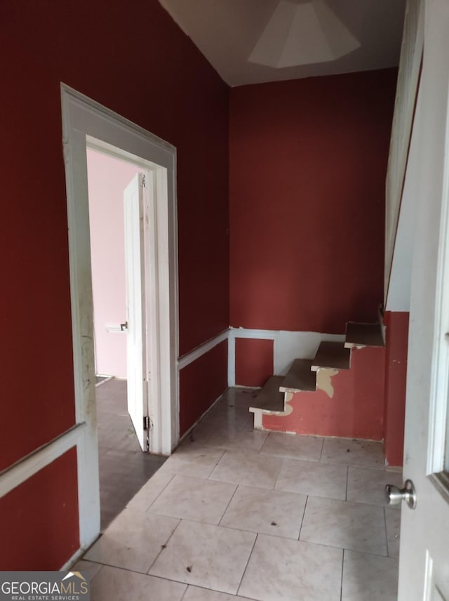 hallway featuring light tile patterned floors