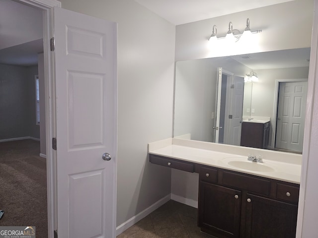 bathroom featuring tile patterned flooring and vanity