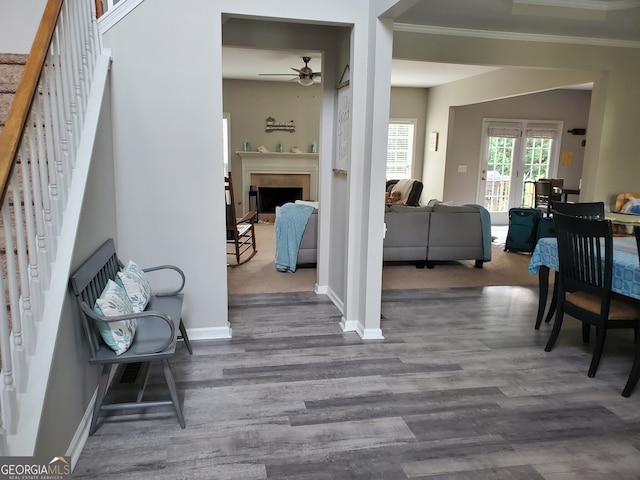 interior space with crown molding and hardwood / wood-style flooring