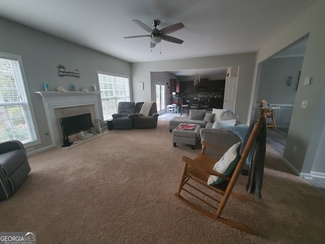 living room featuring carpet flooring and ceiling fan