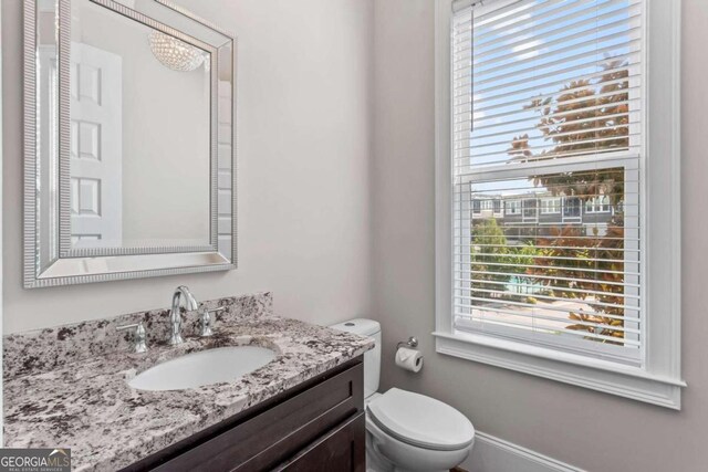 bathroom with vanity and toilet