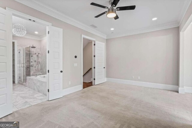 unfurnished bedroom featuring light carpet, ensuite bathroom, ceiling fan, and ornamental molding