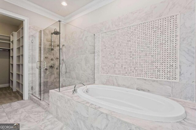 bathroom featuring crown molding and independent shower and bath