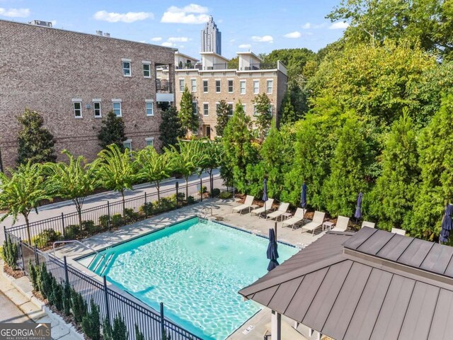 view of swimming pool with a patio area