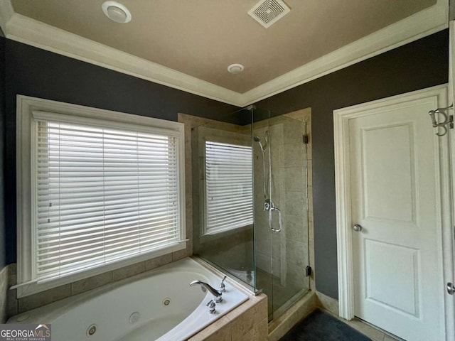 bathroom with ornamental molding and plus walk in shower