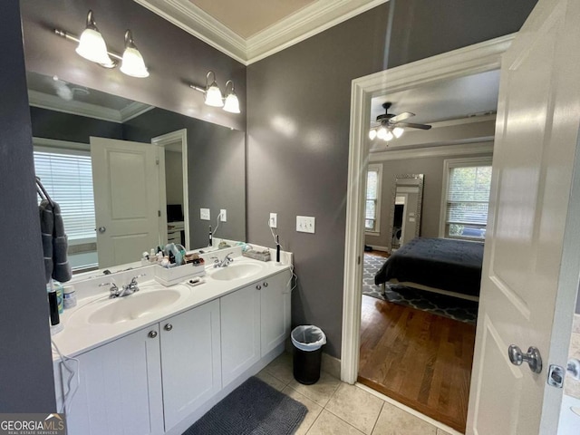 bathroom with tile patterned floors, ceiling fan, a healthy amount of sunlight, and vanity