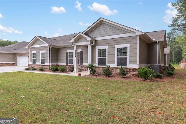 craftsman house with a garage and a front yard