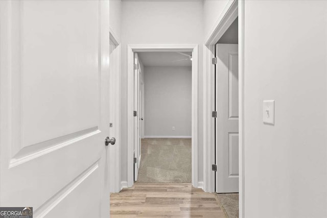 hall with light hardwood / wood-style floors