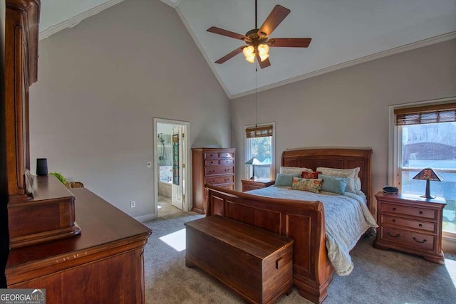 carpeted bedroom with ensuite bathroom, high vaulted ceiling, ceiling fan, and crown molding