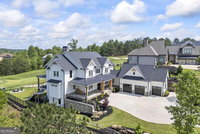 exterior space featuring a front lawn and a garage