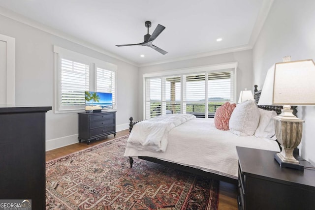 bedroom with wood-type flooring, ceiling fan, and ornamental molding