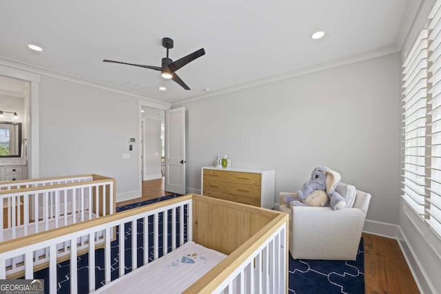 bedroom with dark wood-type flooring, ceiling fan, and crown molding