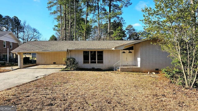 ranch-style house featuring a carport