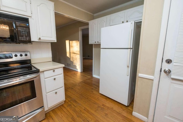 kitchen featuring backsplash, white fridge, stainless steel electric stove, white cabinets, and light wood-type flooring