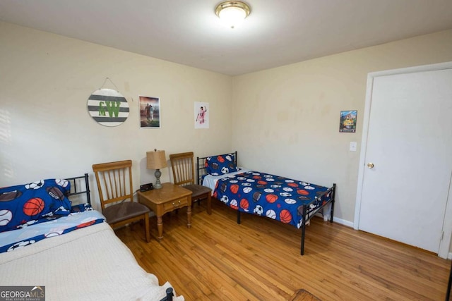 bedroom with hardwood / wood-style floors