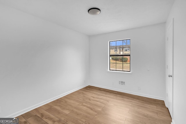 spare room with light wood-type flooring