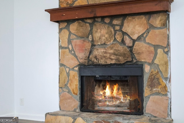 room details with a stone fireplace