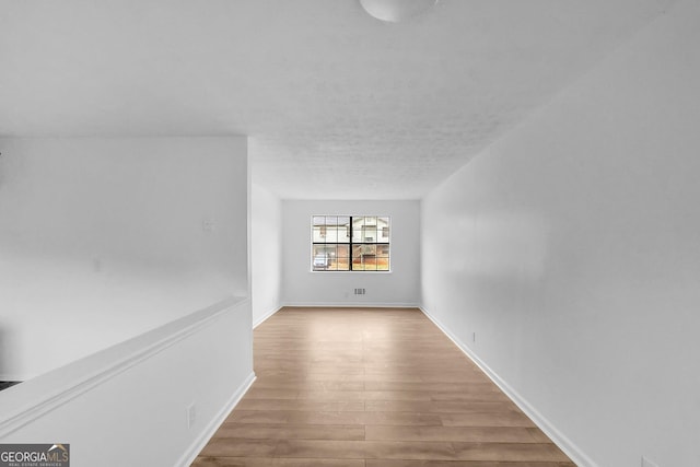 empty room featuring hardwood / wood-style floors