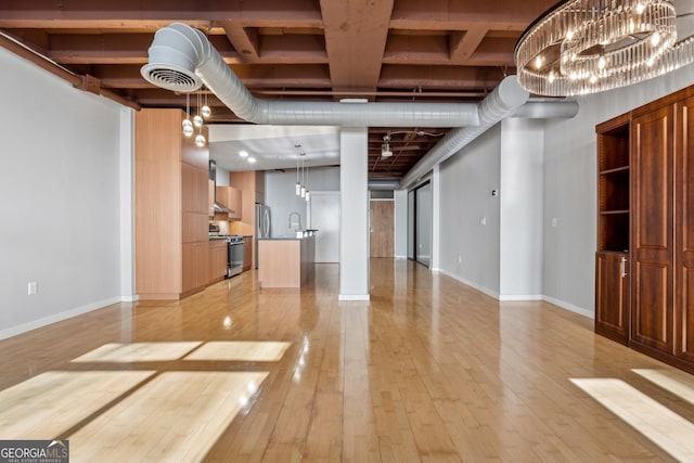 interior space featuring sink and light hardwood / wood-style flooring